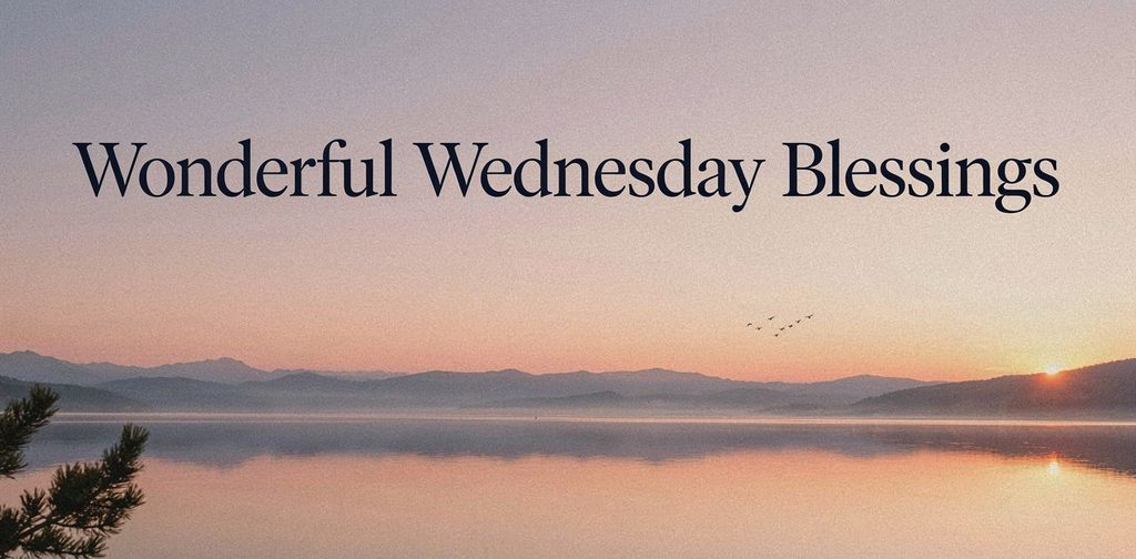 Peaceful Wednesday sunrise over a misty mountain lake with warm golden light